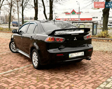Черный Мицубиси Лансер, объемом двигателя 2 л и пробегом 169 тыс. км за 6800 $, фото 4 на Automoto.ua