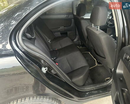 Черный Мицубиси Лансер, объемом двигателя 1.5 л и пробегом 202 тыс. км за 6500 $, фото 31 на Automoto.ua