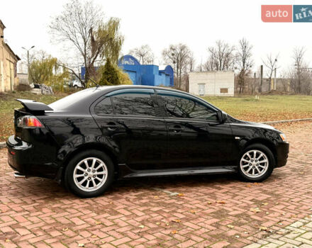 Черный Мицубиси Лансер, объемом двигателя 2 л и пробегом 169 тыс. км за 6800 $, фото 5 на Automoto.ua