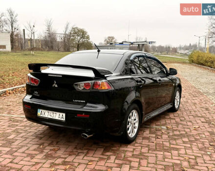 Черный Мицубиси Лансер, объемом двигателя 2 л и пробегом 169 тыс. км за 6800 $, фото 22 на Automoto.ua