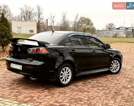 Черный Мицубиси Лансер, объемом двигателя 2 л и пробегом 169 тыс. км за 6800 $, фото 13 на Automoto.ua