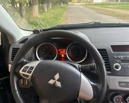 Черный Мицубиси Лансер, объемом двигателя 1.5 л и пробегом 202 тыс. км за 6500 $, фото 36 на Automoto.ua