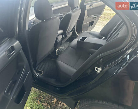 Черный Мицубиси Лансер, объемом двигателя 1.5 л и пробегом 202 тыс. км за 6500 $, фото 27 на Automoto.ua