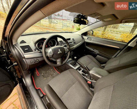 Черный Мицубиси Лансер, объемом двигателя 2 л и пробегом 169 тыс. км за 6800 $, фото 27 на Automoto.ua