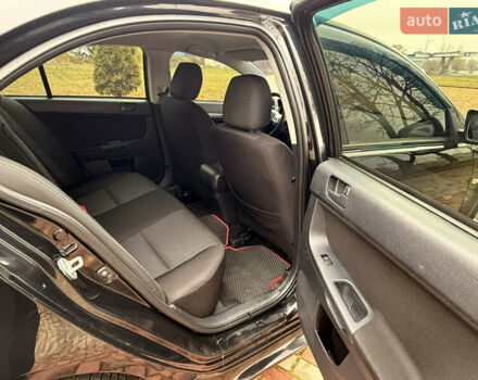 Черный Мицубиси Лансер, объемом двигателя 2 л и пробегом 169 тыс. км за 6800 $, фото 33 на Automoto.ua