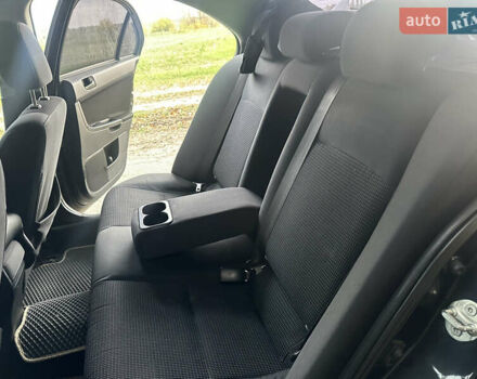 Черный Мицубиси Лансер, объемом двигателя 1.5 л и пробегом 202 тыс. км за 6500 $, фото 28 на Automoto.ua