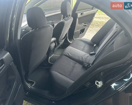 Черный Мицубиси Лансер, объемом двигателя 1.5 л и пробегом 202 тыс. км за 6500 $, фото 33 на Automoto.ua