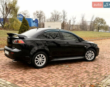 Черный Мицубиси Лансер, объемом двигателя 2 л и пробегом 169 тыс. км за 6800 $, фото 14 на Automoto.ua