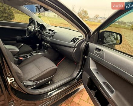 Черный Мицубиси Лансер, объемом двигателя 2 л и пробегом 169 тыс. км за 6800 $, фото 32 на Automoto.ua