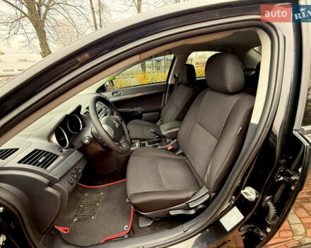 Черный Мицубиси Лансер, объемом двигателя 2 л и пробегом 169 тыс. км за 6800 $, фото 26 на Automoto.ua