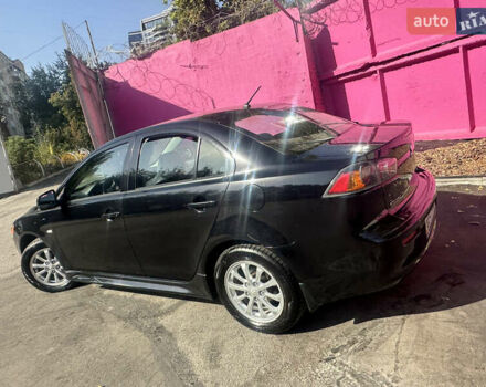 Черный Мицубиси Лансер, объемом двигателя 2 л и пробегом 158 тыс. км за 10800 $, фото 4 на Automoto.ua