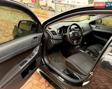 Черный Мицубиси Лансер, объемом двигателя 2 л и пробегом 169 тыс. км за 6800 $, фото 25 на Automoto.ua