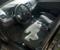 Мицубиси Лансер 2011 в Кропивницком (Кировограде) на Automoto.ua Черный Мицубиси Лансер, объемом двигателя 1.5 л и пробегом 150 тыс. км за 7000 $, фото 4 на Automoto.ua