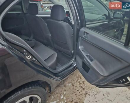 Черный Мицубиси Лансер, объемом двигателя 1.5 л и пробегом 222 тыс. км за 4900 $, фото 15 на Automoto.ua