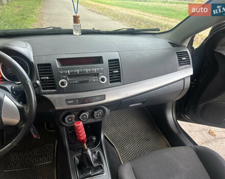 Черный Мицубиси Лансер, объемом двигателя 1.5 л и пробегом 202 тыс. км за 6500 $, фото 39 на Automoto.ua