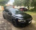 Чорний Міцубісі Lancer, об'ємом двигуна 2 л та пробігом 106 тис. км за 7495 $, фото 1 на Automoto.ua