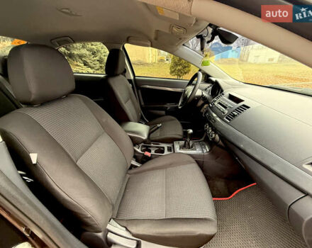 Черный Мицубиси Лансер, объемом двигателя 2 л и пробегом 169 тыс. км за 6800 $, фото 31 на Automoto.ua