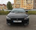 Чорний Міцубісі Lancer, об'ємом двигуна 2 л та пробігом 259 тис. км за 7300 $, фото 1 на Automoto.ua