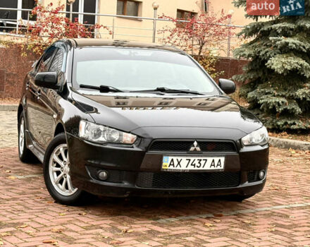 Черный Мицубиси Лансер, объемом двигателя 2 л и пробегом 169 тыс. км за 6800 $, фото 3 на Automoto.ua