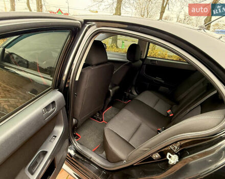 Черный Мицубиси Лансер, объемом двигателя 2 л и пробегом 169 тыс. км за 6800 $, фото 29 на Automoto.ua