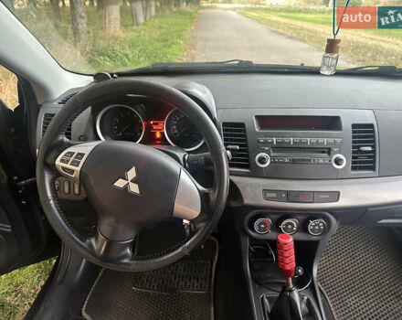 Черный Мицубиси Лансер, объемом двигателя 1.5 л и пробегом 202 тыс. км за 6500 $, фото 41 на Automoto.ua