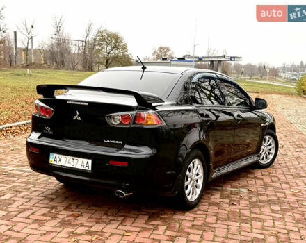 Черный Мицубиси Лансер, объемом двигателя 2 л и пробегом 169 тыс. км за 6800 $, фото 12 на Automoto.ua