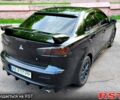 Черный Мицубиси Лансер, объемом двигателя 1.6 л и пробегом 250 тыс. км за 8000 $, фото 1 на Automoto.ua