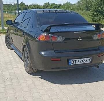 Черный Мицубиси Лансер, объемом двигателя 2 л и пробегом 170 тыс. км за 7500 $, фото 7 на Automoto.ua