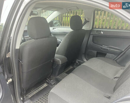 Черный Мицубиси Лансер, объемом двигателя 1.8 л и пробегом 224 тыс. км за 7300 $, фото 9 на Automoto.ua