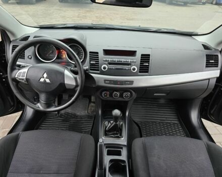 Черный Мицубиси Лансер, объемом двигателя 2 л и пробегом 223 тыс. км за 5500 $, фото 9 на Automoto.ua