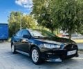 Чорний Міцубісі Lancer, об'ємом двигуна 2 л та пробігом 235 тис. км за 6898 $, фото 1 на Automoto.ua
