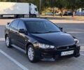 Черный Мицубиси Лансер, объемом двигателя 2 л и пробегом 245 тыс. км за 7300 $, фото 1 на Automoto.ua