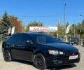 Черный Мицубиси Лансер, объемом двигателя 1.6 л и пробегом 150 тыс. км за 7426 $, фото 1 на Automoto.ua