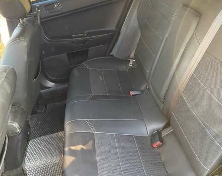 Черный Мицубиси Лансер, объемом двигателя 2 л и пробегом 175 тыс. км за 9200 $, фото 5 на Automoto.ua