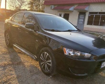 Черный Мицубиси Лансер, объемом двигателя 2 л и пробегом 175 тыс. км за 9200 $, фото 2 на Automoto.ua