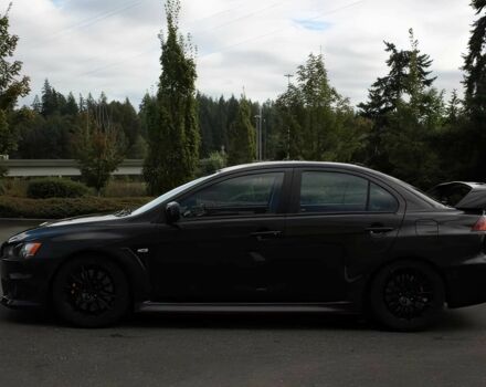 Чорний Міцубісі Lancer, об'ємом двигуна 2 л та пробігом 82 тис. км за 11000 $, фото 3 на Automoto.ua