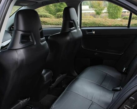 Чорний Міцубісі Lancer, об'ємом двигуна 2 л та пробігом 82 тис. км за 11000 $, фото 11 на Automoto.ua