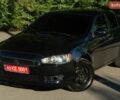Чорний Міцубісі Lancer, об'ємом двигуна 1.59 л та пробігом 150 тис. км за 7400 $, фото 1 на Automoto.ua