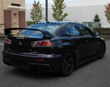 Чорний Міцубісі Lancer, об'ємом двигуна 2 л та пробігом 82 тис. км за 11000 $, фото 4 на Automoto.ua