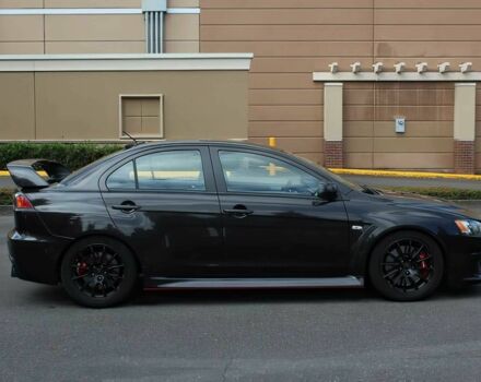 Чорний Міцубісі Lancer, об'ємом двигуна 2 л та пробігом 82 тис. км за 11000 $, фото 7 на Automoto.ua