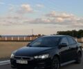Черный Мицубиси Лансер, объемом двигателя 2 л и пробегом 245 тыс. км за 7390 $, фото 1 на Automoto.ua