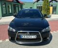 Черный Мицубиси Лансер, объемом двигателя 1.59 л и пробегом 130 тыс. км за 10000 $, фото 1 на Automoto.ua