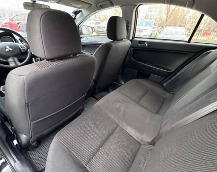 Черный Мицубиси Лансер, объемом двигателя 2 л и пробегом 156 тыс. км за 8999 $, фото 10 на Automoto.ua