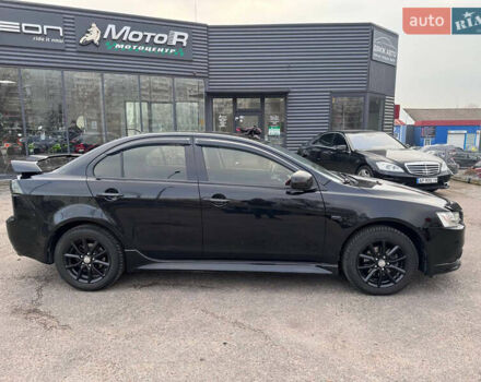 Черный Мицубиси Лансер, объемом двигателя 2 л и пробегом 156 тыс. км за 8999 $, фото 6 на Automoto.ua