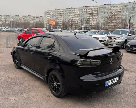 Черный Мицубиси Лансер, объемом двигателя 2 л и пробегом 156 тыс. км за 8999 $, фото 3 на Automoto.ua