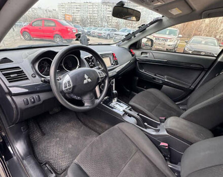 Черный Мицубиси Лансер, объемом двигателя 2 л и пробегом 156 тыс. км за 8999 $, фото 8 на Automoto.ua