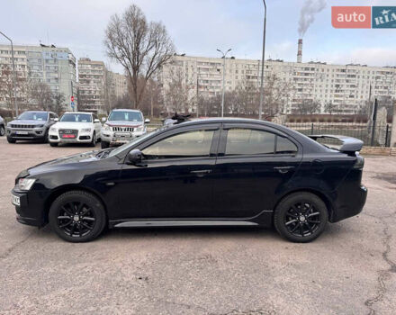 Черный Мицубиси Лансер, объемом двигателя 2 л и пробегом 156 тыс. км за 8999 $, фото 2 на Automoto.ua