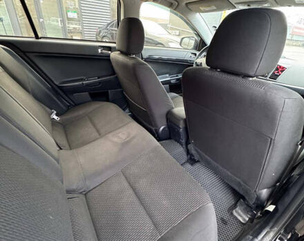 Черный Мицубиси Лансер, объемом двигателя 2 л и пробегом 156 тыс. км за 8999 $, фото 13 на Automoto.ua