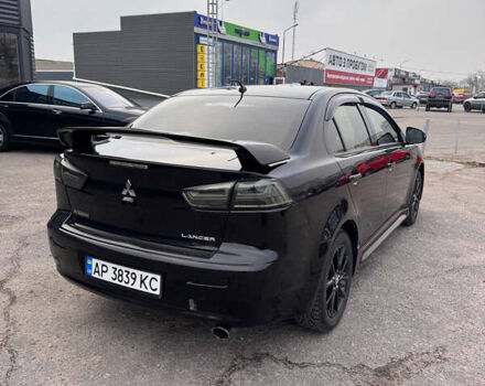 Черный Мицубиси Лансер, объемом двигателя 2 л и пробегом 156 тыс. км за 8999 $, фото 5 на Automoto.ua