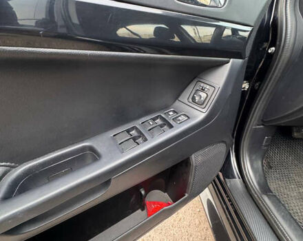 Черный Мицубиси Лансер, объемом двигателя 2 л и пробегом 156 тыс. км за 8999 $, фото 9 на Automoto.ua